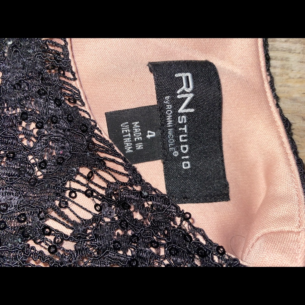 nude pink topped with black lace dress. slim straight dress with sequins